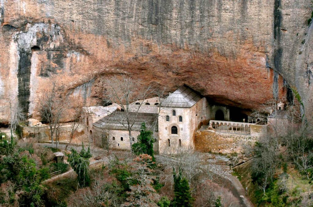 A photo of a monastery set into a cliff. A cultural visit we do on our Spanish Laguage Walking Holiday Advanced Level
