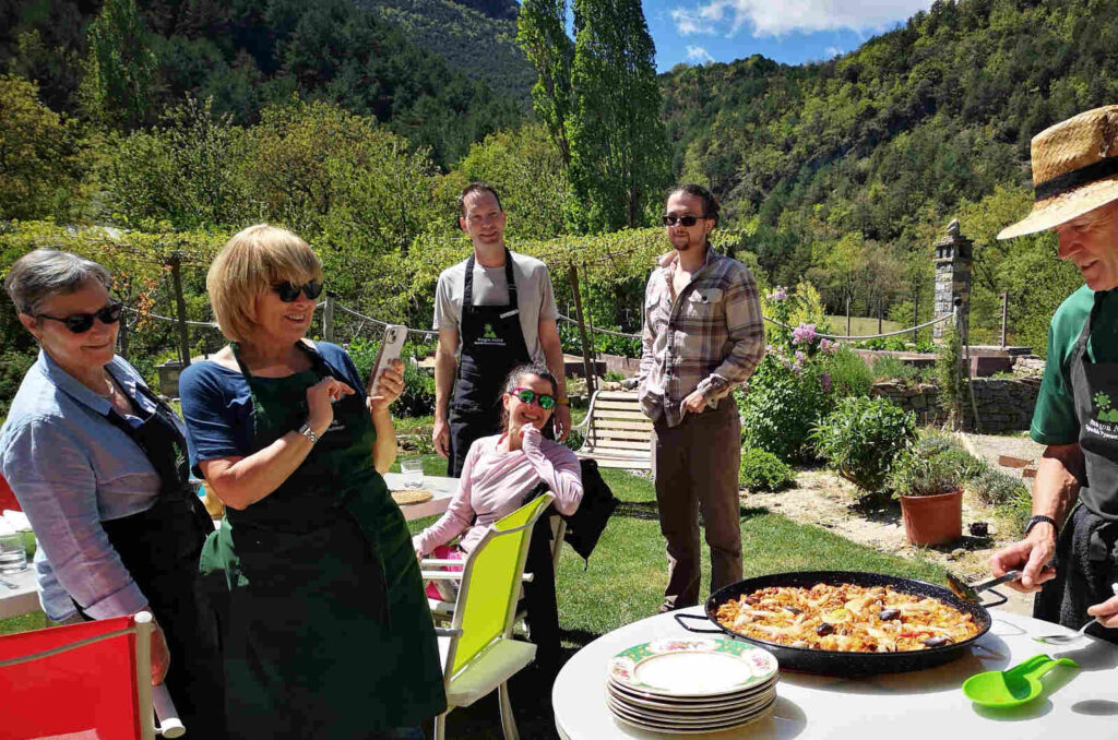 A group cooking a paella on Cooking Holidays Spain in the Spanish Pyrenees with Aragon Active