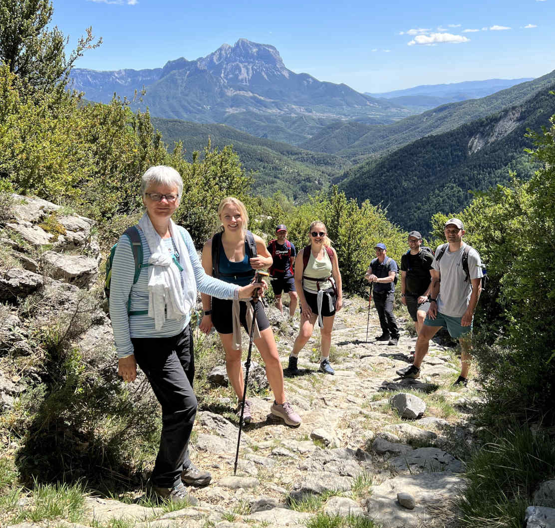 A group face the camera for a photo on a hike on Cooking Holidays Spain with Aragon Active