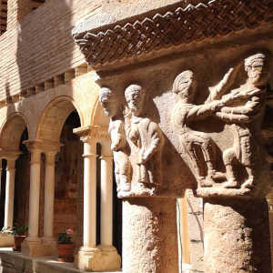 A close up of an early carved capital in the cloisters at Alquezar on our culture and gastronomy holidays Spain with Aragon Active small group holidays