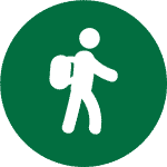 An green icon with a white hiker representing the guided hikes on our Cooking Holidays Spain in the Spanish Pyrenees with Aragon Active