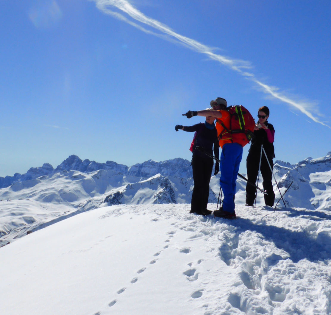A group nearly at the snowy summit on our snowshoeing holiday with Aragon Active small group holidays