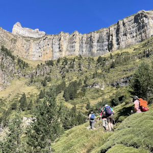 A hiking group ascend on the faja racon pathway in the Spanish Pyrenees on Walking Holidays in Spain with Aragon Active